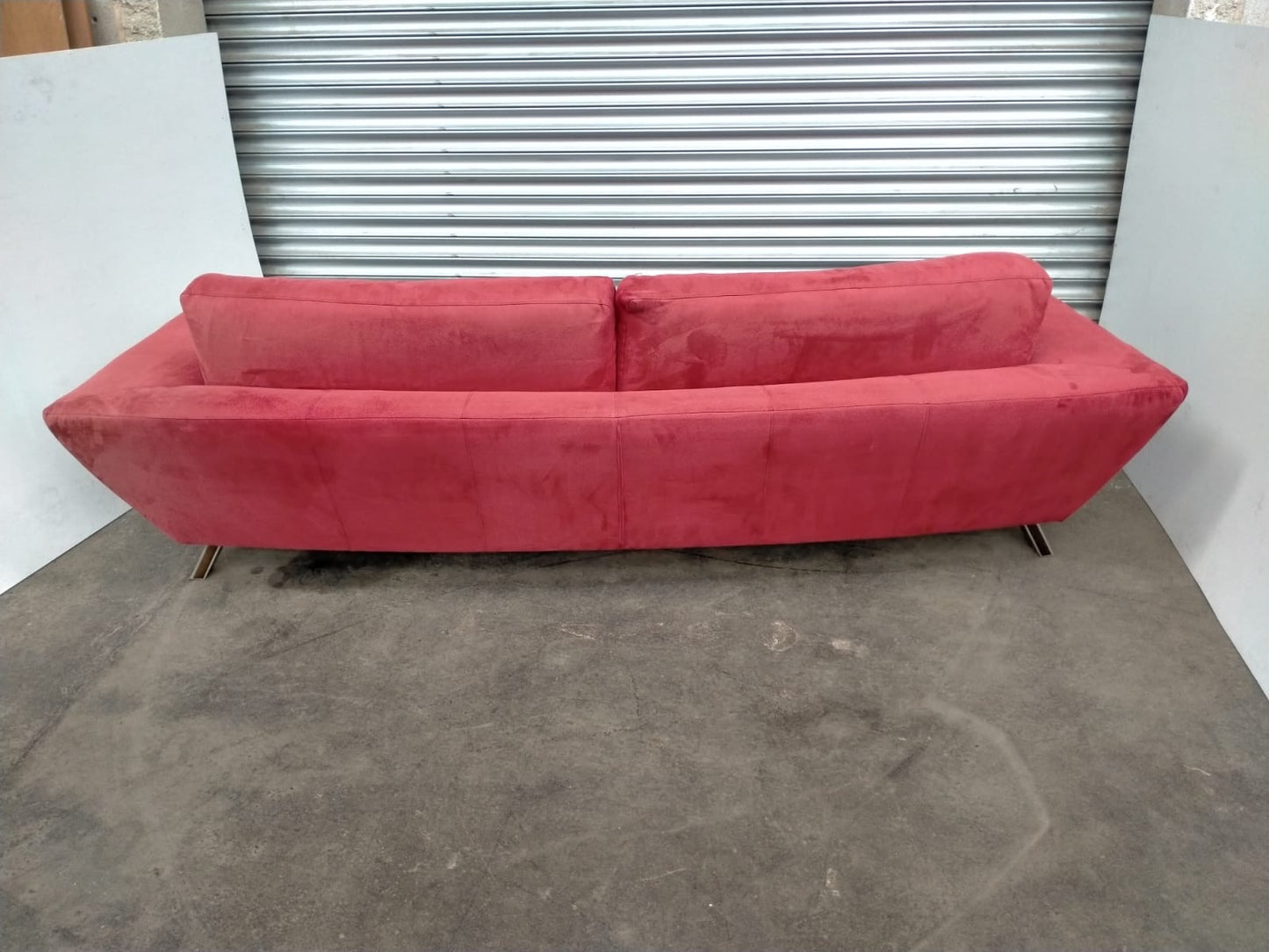Indulge in Luxury and Style with NATUZZI's Elegant Red Fabric Sofa.