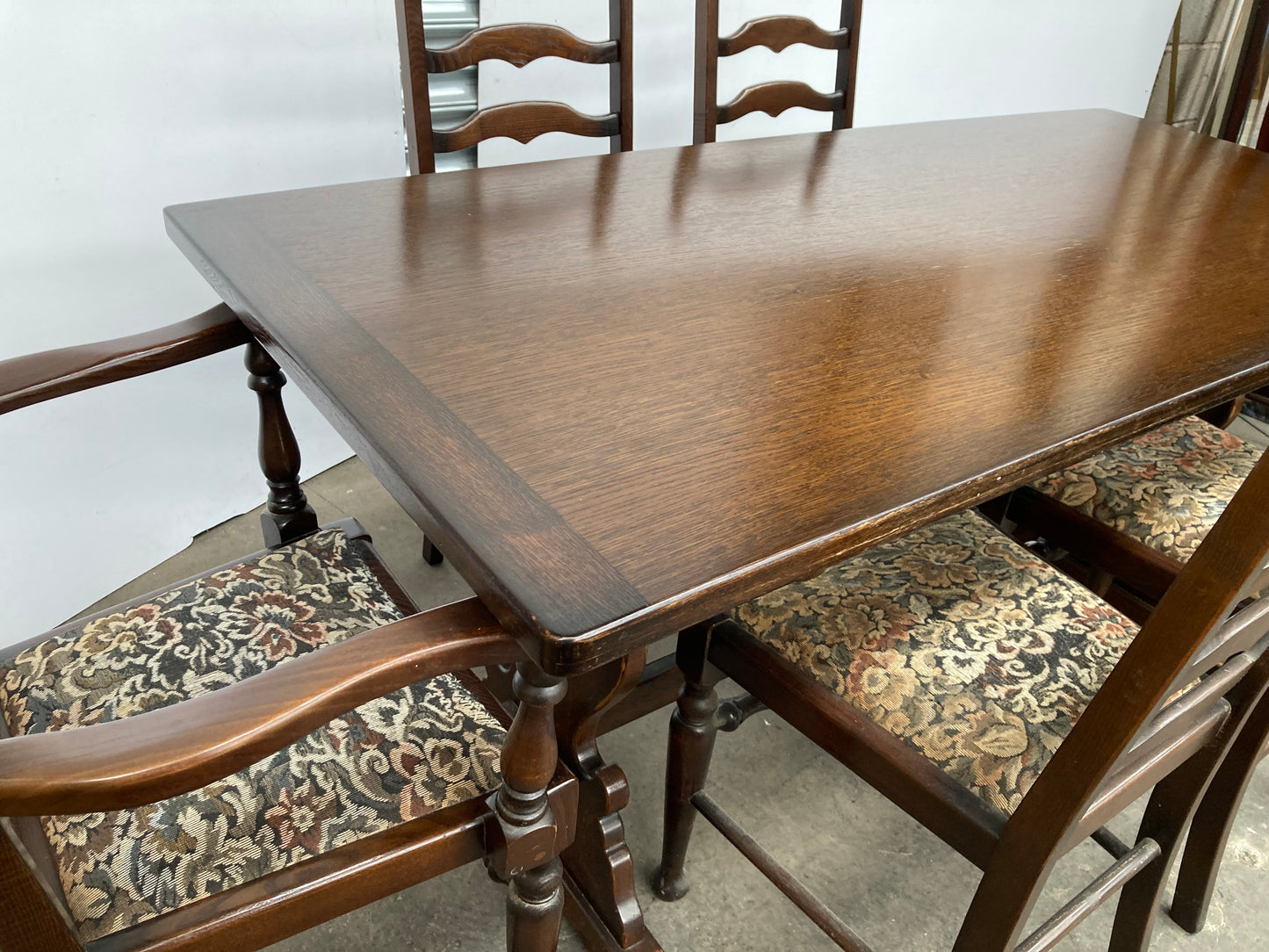 Dark oak dining table and 6 chairs