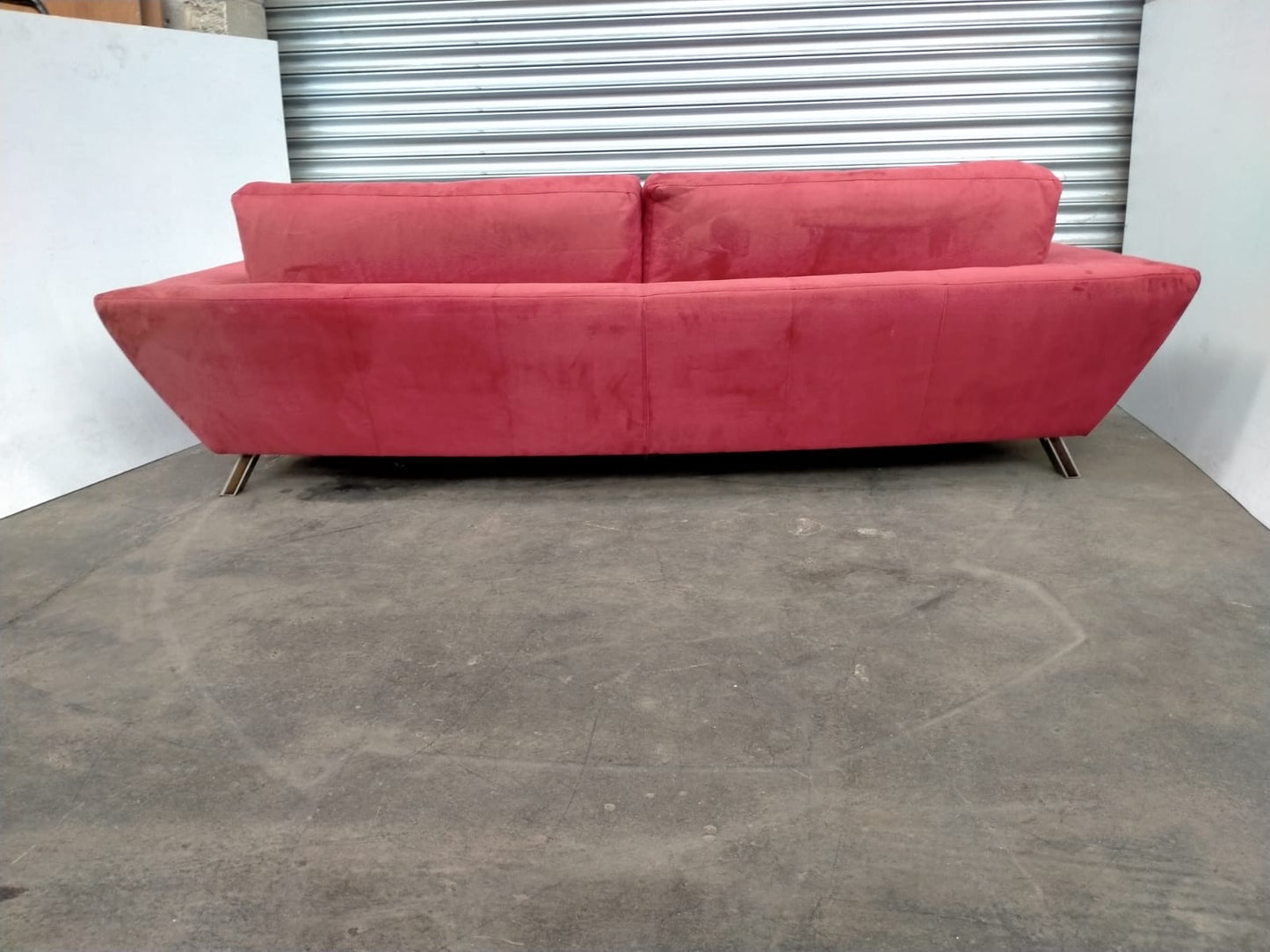 Indulge in Luxury and Style with NATUZZI's Elegant Red Fabric Sofa.