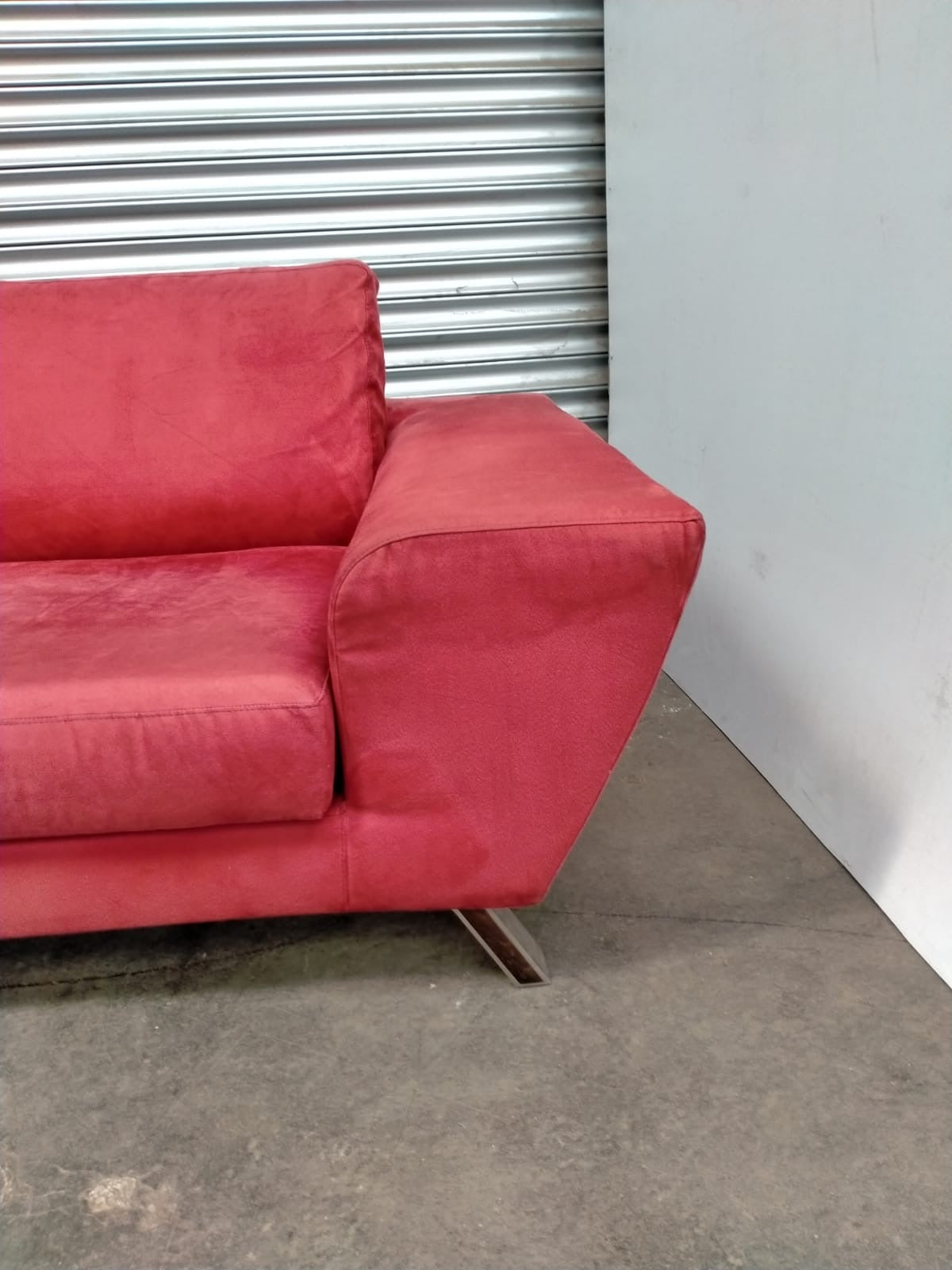 Indulge in Luxury and Style with NATUZZI's Elegant Red Fabric Sofa.