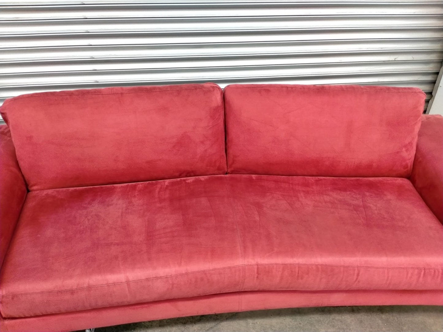 Indulge in Luxury and Style with NATUZZI's Elegant Red Fabric Sofa.