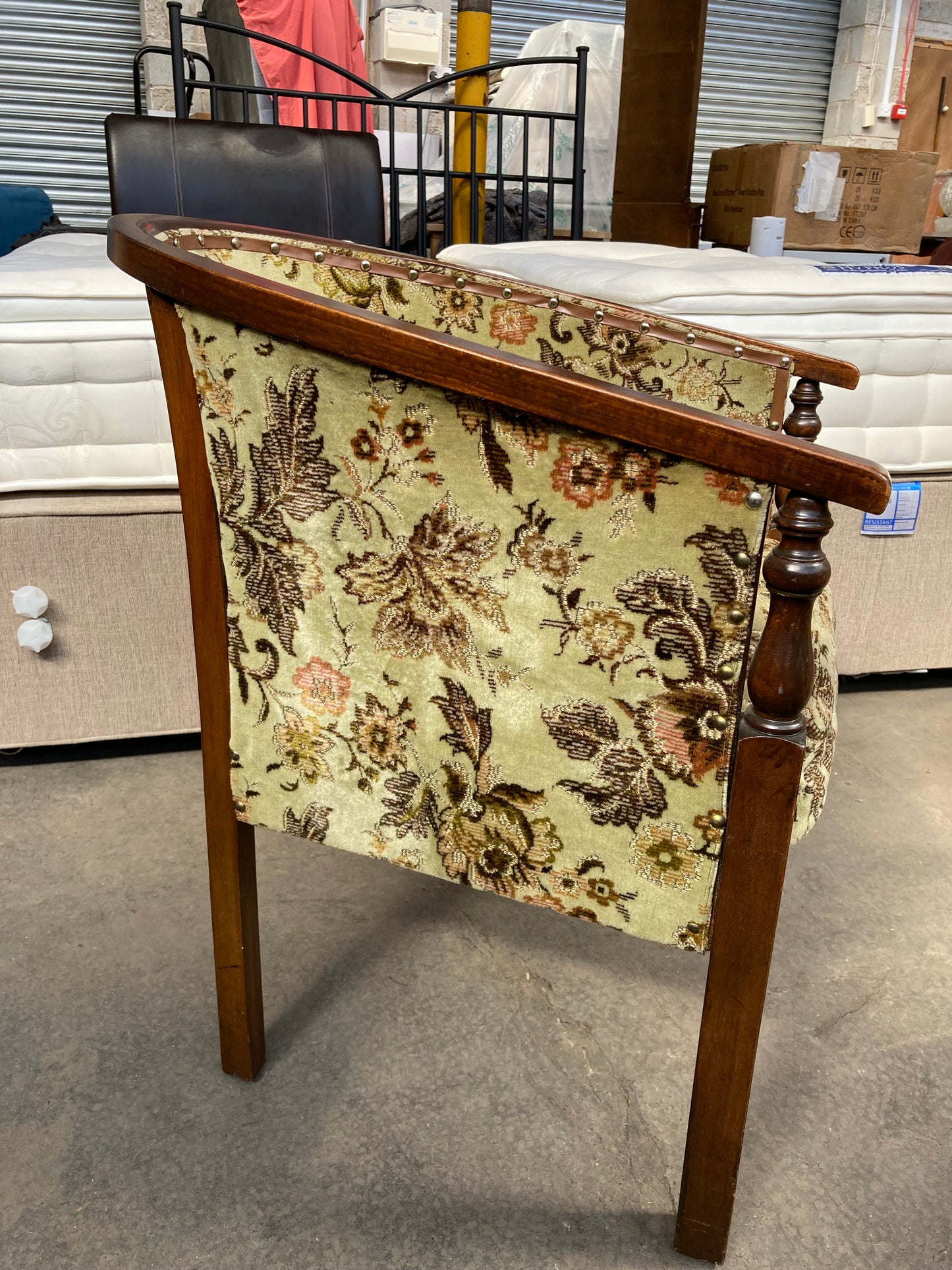 Vintage studded tub chair with floral fabric