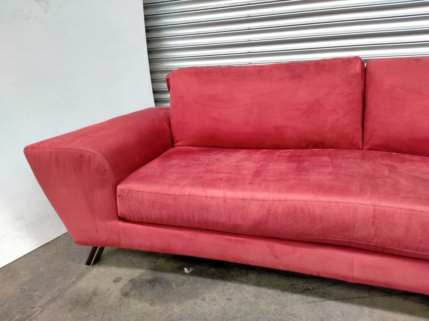 Indulge in Luxury and Style with NATUZZI's Elegant Red Fabric Sofa.