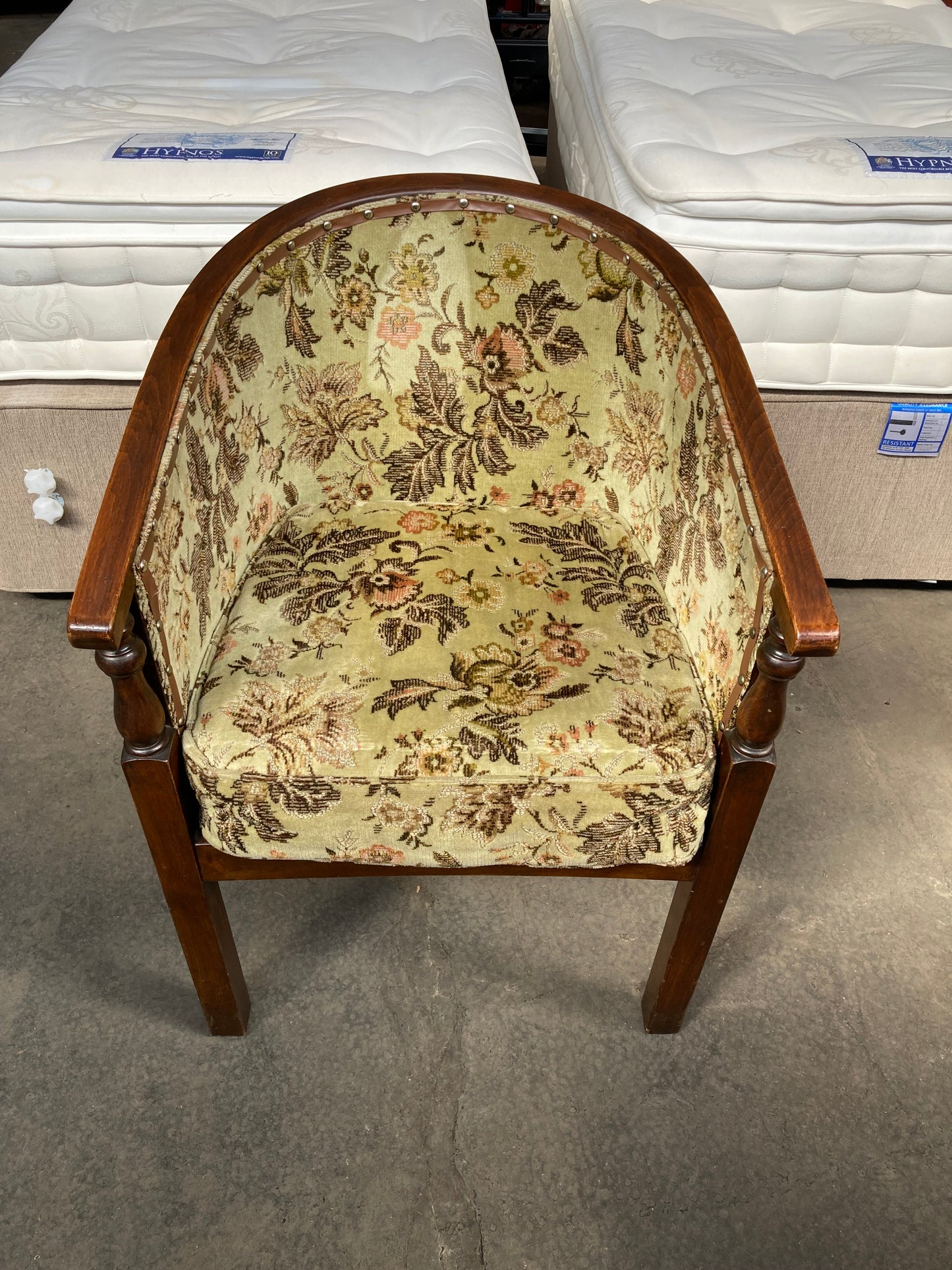 Vintage studded tub chair with floral fabric