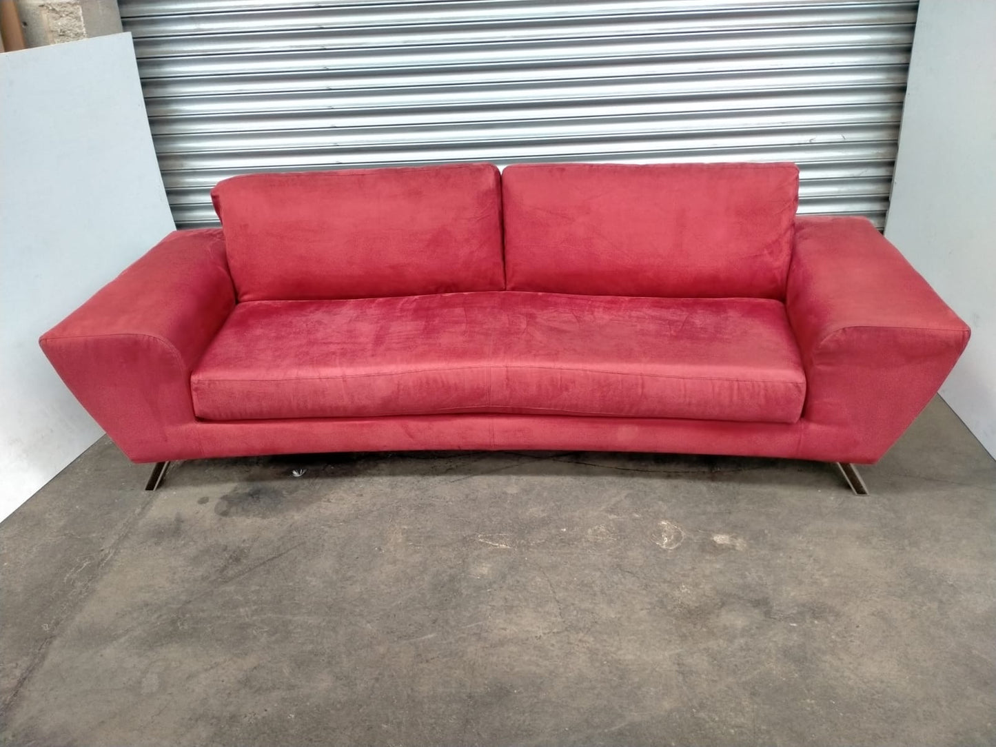 Indulge in Luxury and Style with NATUZZI's Elegant Red Fabric Sofa.