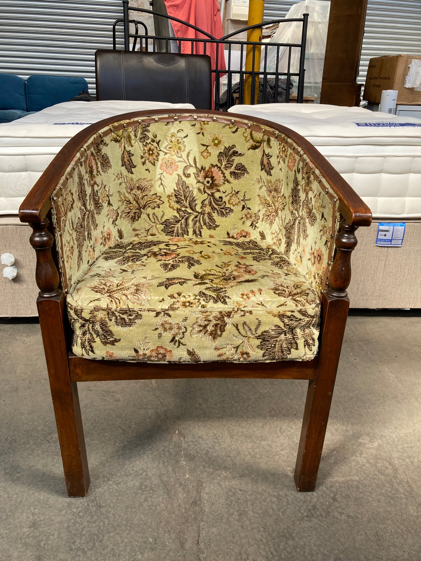 Vintage studded tub chair with floral fabric